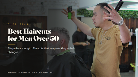 Barber cutting an older client's hair at Republic Of Barbers, Unley Road, Malvern