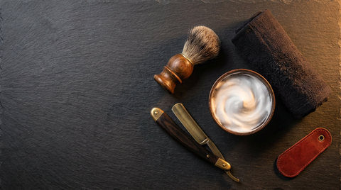 Traditional wet shave tools — straight razor, shaving brush, lather and warm towel — for a hot towel face shave at Republic Of Barbers, Unley Road